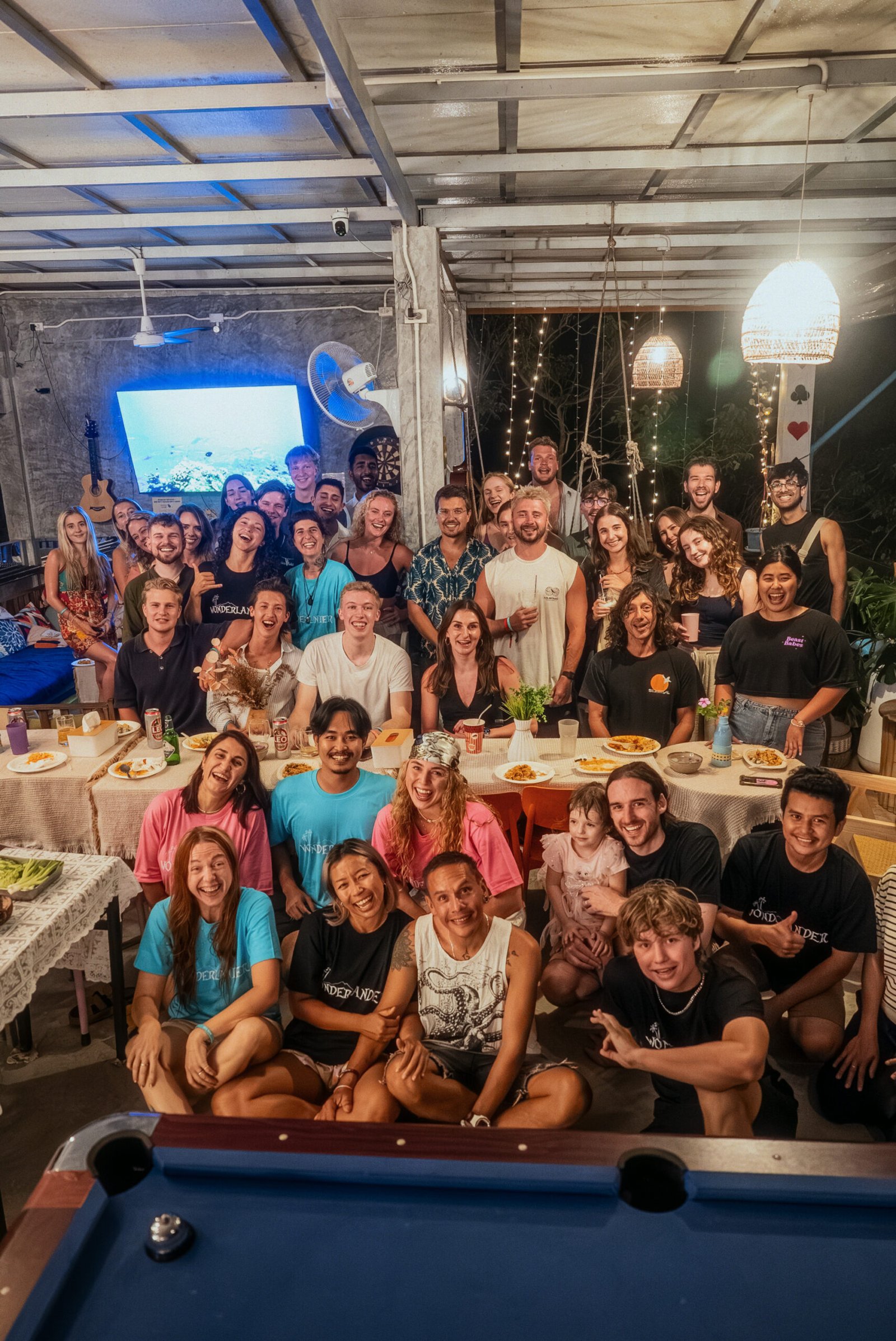 Guests and staff at Wonderland Jungle Hostel, Koh Tao — the community that turns strangers into family