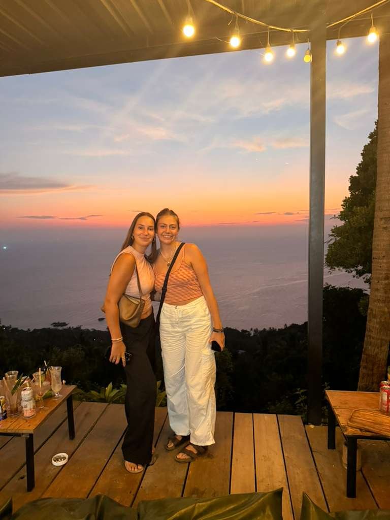 wonderland guests at a sunset bar - best sunset spots in koh tao